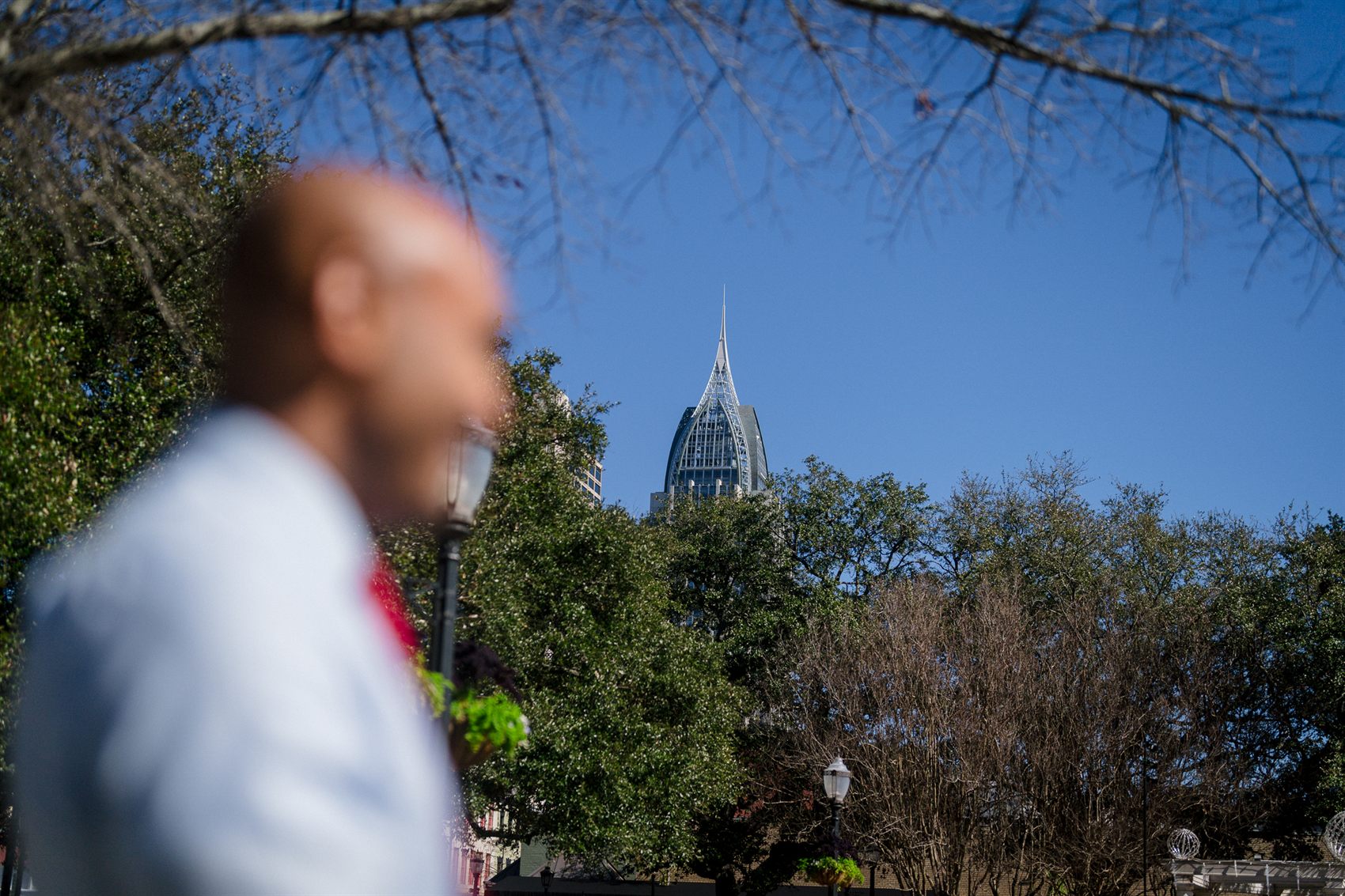 The Mobile, Alabama skyline behind Shomari Figures